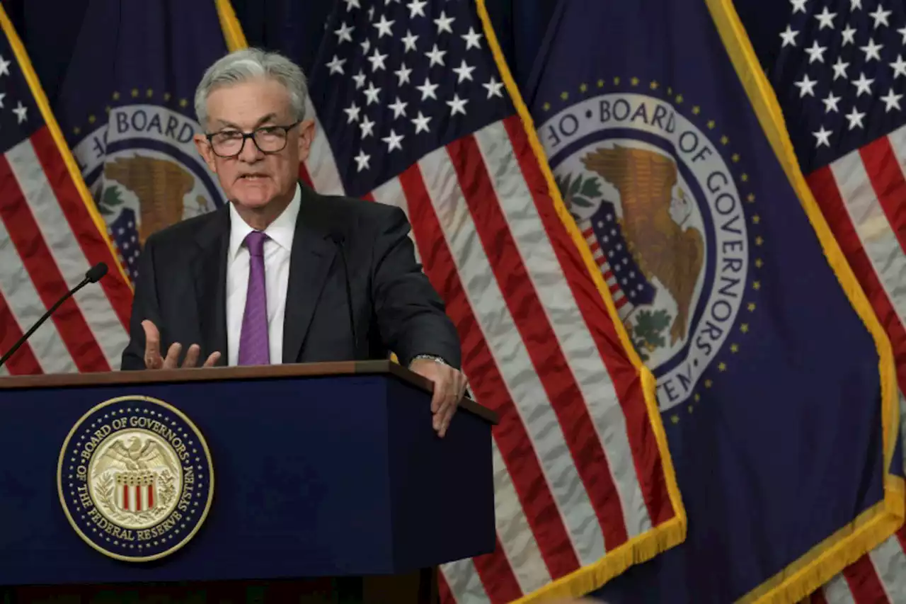 US Fed pauses rate hikes but predicts long fight against inflation