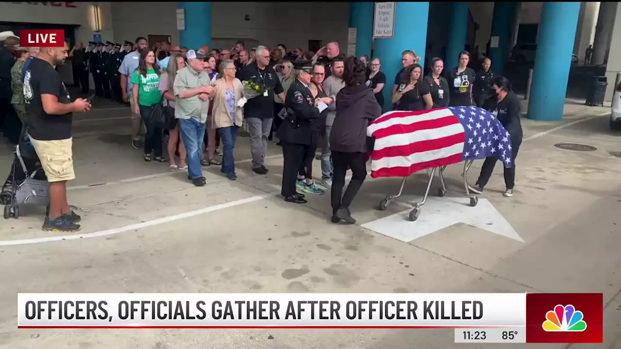 Family, police officials form ‘Wall of Honor' as fallen Arlington officer escorted from hospital