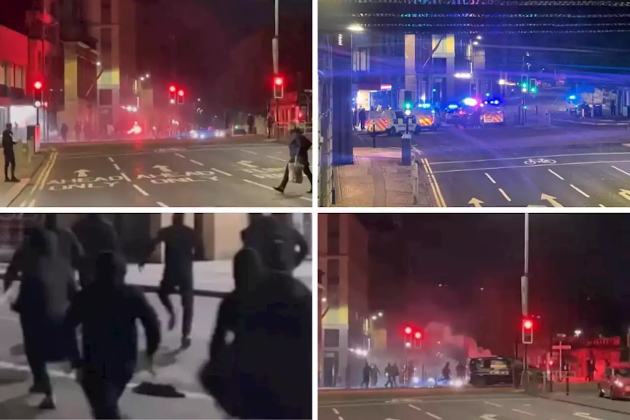 Shocking moment city centre hotel stormed by DOZENS of masked thugs