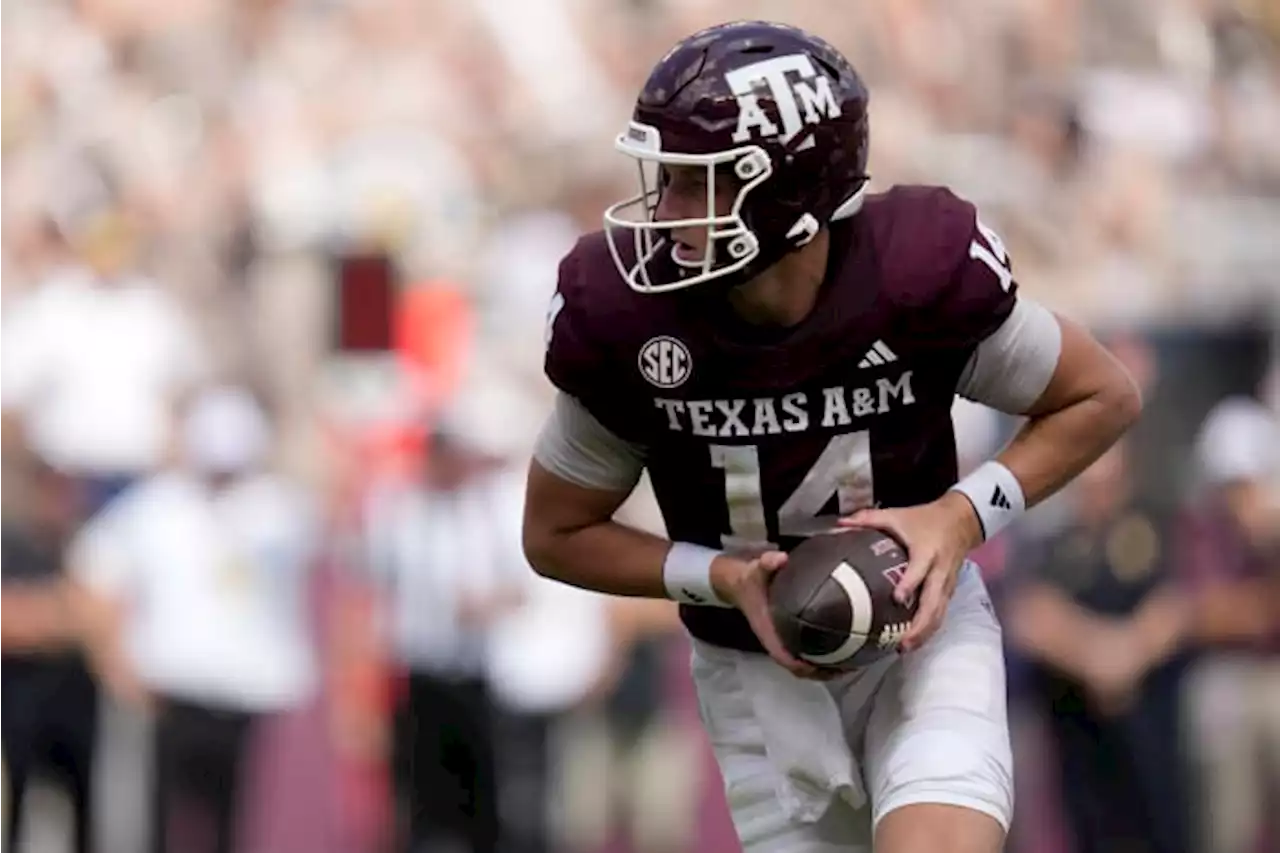 Johnson throws 2 TD passes after Weigman injured to lead Texas A&M to 27-10 win over Auburn