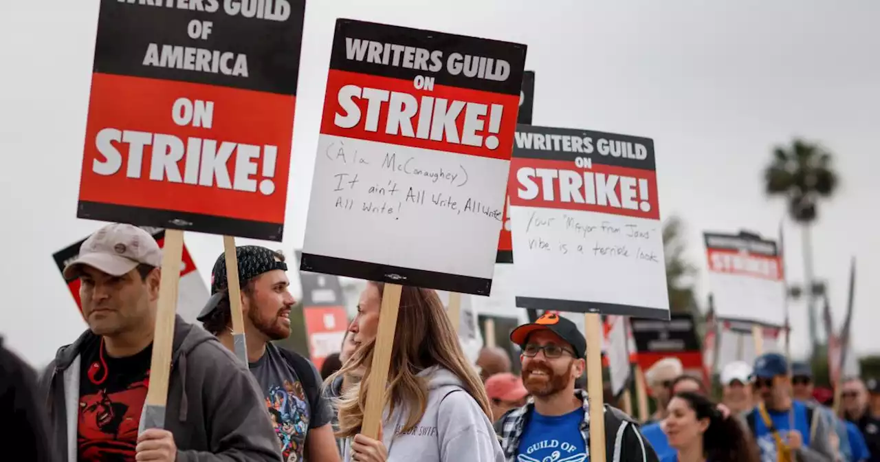 WGA, studios bargain for third straight day with throngs of writers hitting picket lines