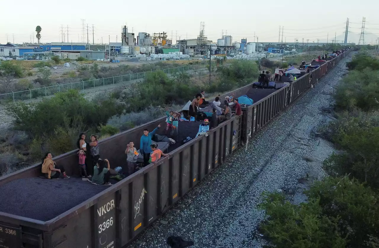 Mexican officials push migrants away from border-bound cargo trains