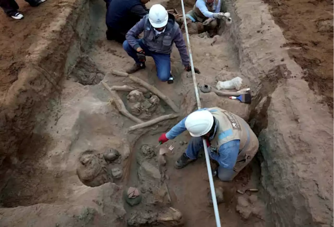 Workers uncover eight mummies and pre-Inca objects while expanding the gas network in Peru