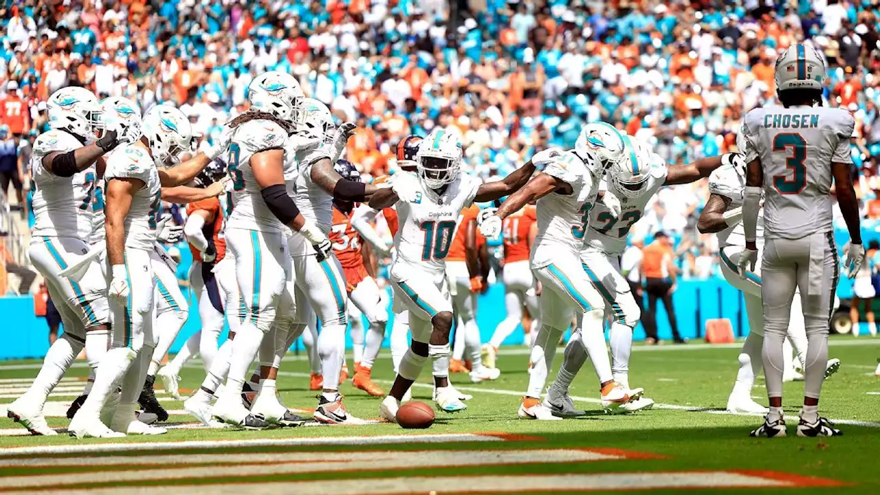 Dolphins drop 70 points on Broncos in record day