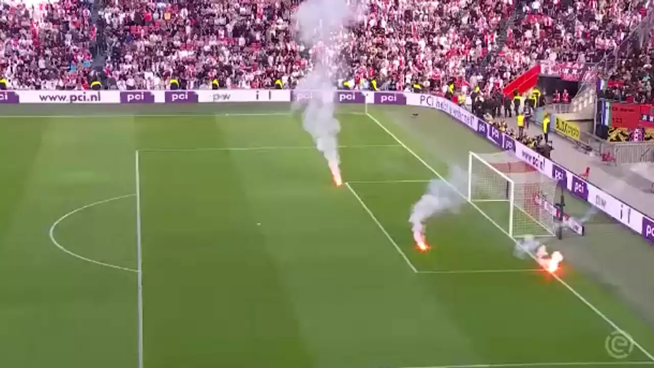 Ajax vs Feyenoord abandoned after flares thrown onto pitch at Johan Cruyff Arena.