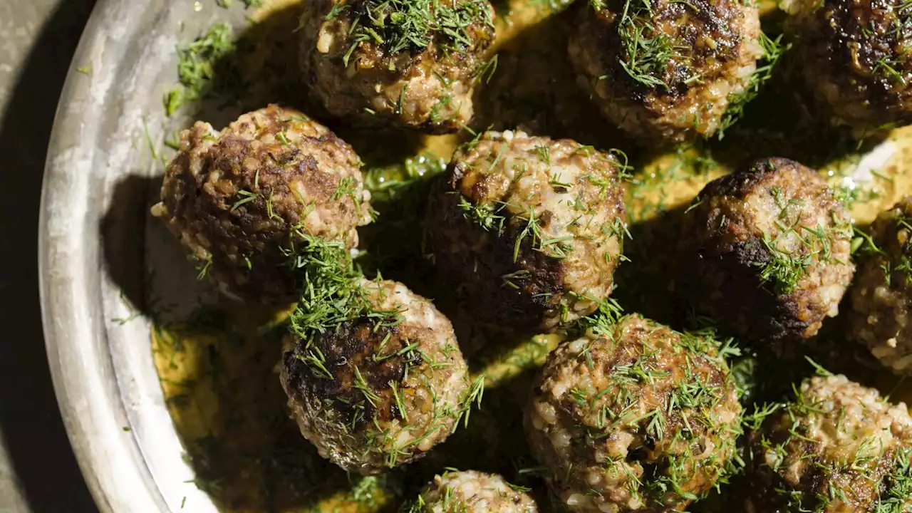 Lemony olive oil sauce enriches Greek beef and rice meatballs