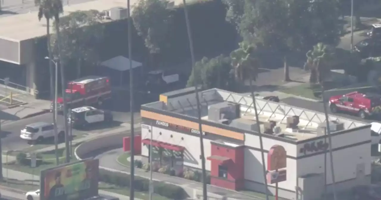 Police in standoff with barricaded suspect who shot two men in East Hollywood