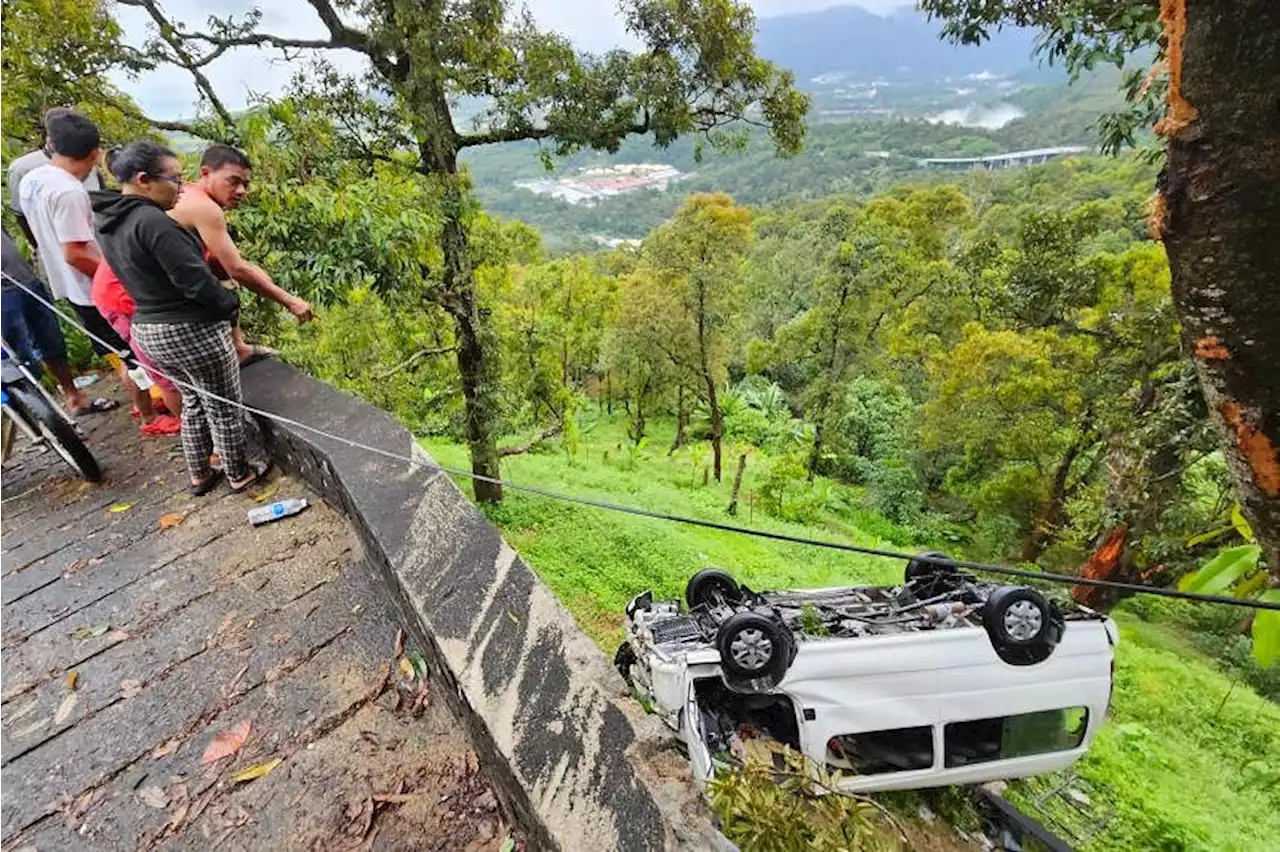 Residents use rocks to smash windows to rescue trapped Singapore tourists in Penang van crash