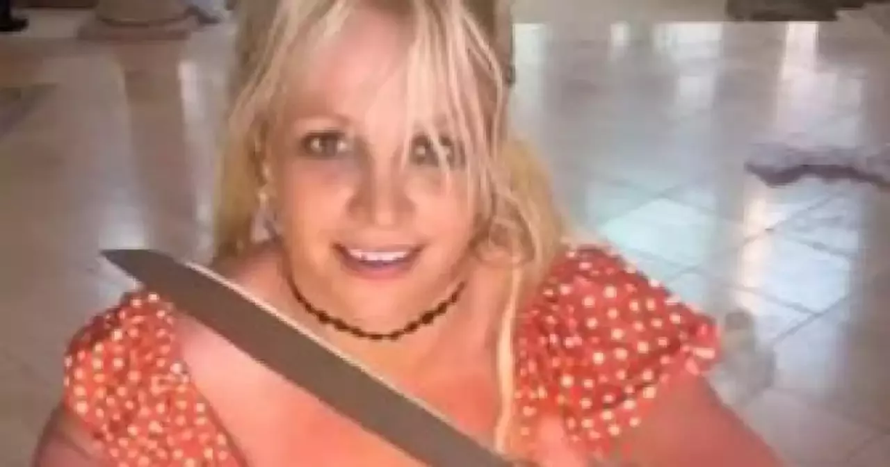 Britney Spears waves knives around in latest video and tells fans not ...