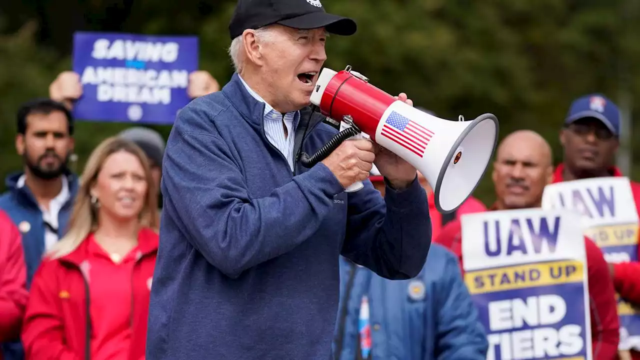 Biden urges striking auto workers to 'stick with it' in picket line visit unparalleled in history