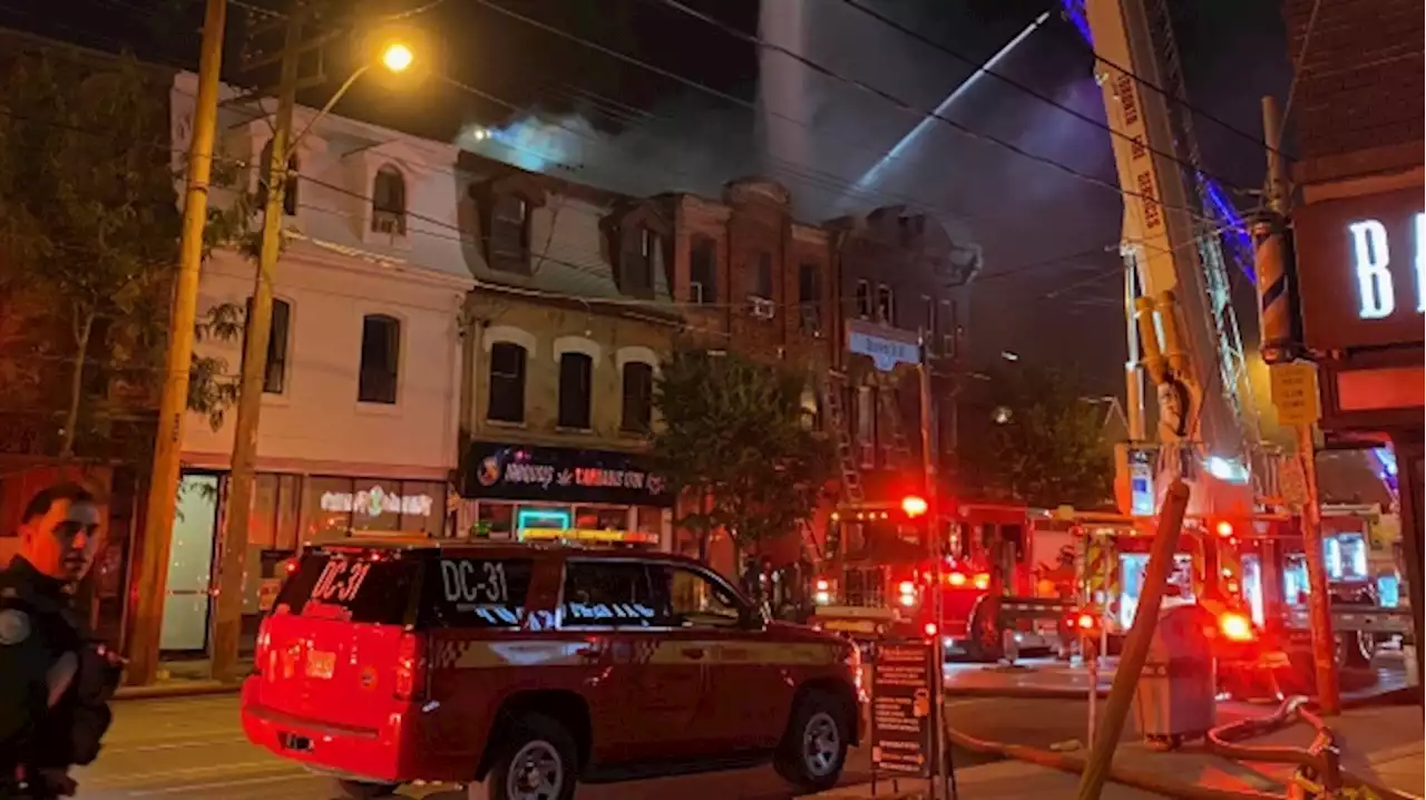 Four-alarm fire in city's Queen West neighbourhood leaves 2 people, including firefighter, injured