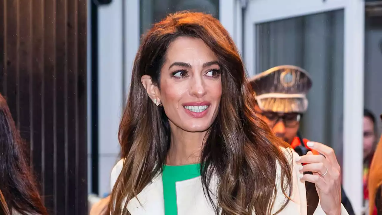 Amal Clooney’s Latest Trench and Midi Dress Combo Was a Lesson in Fall Layering