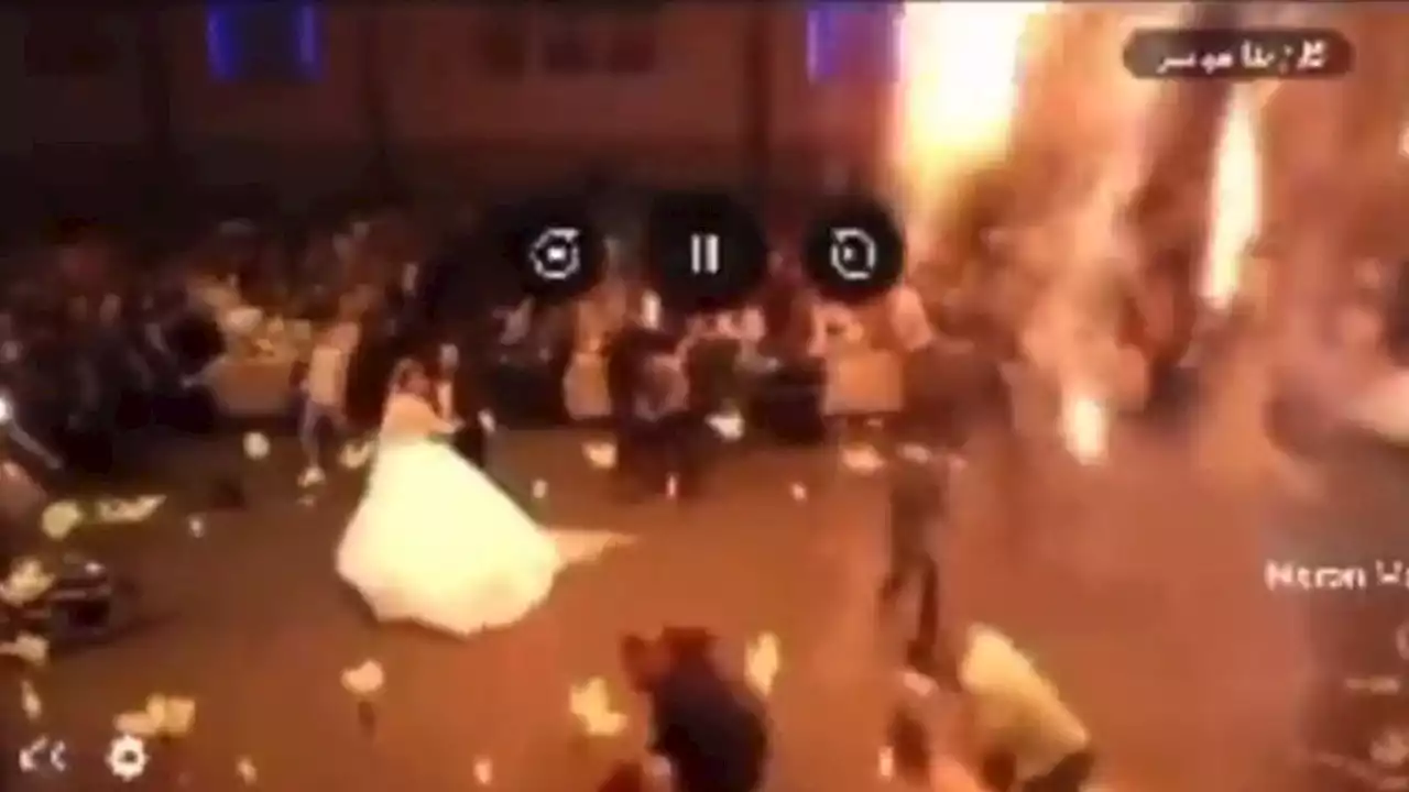 More than 100 dead in Iraq wedding blaze after 'firework was set off before bride and groom's slow dance'