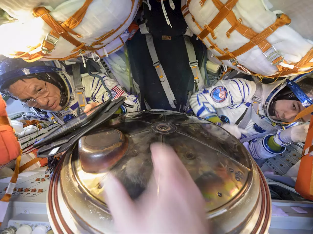 Three astronauts return to Earth after being stuck in space