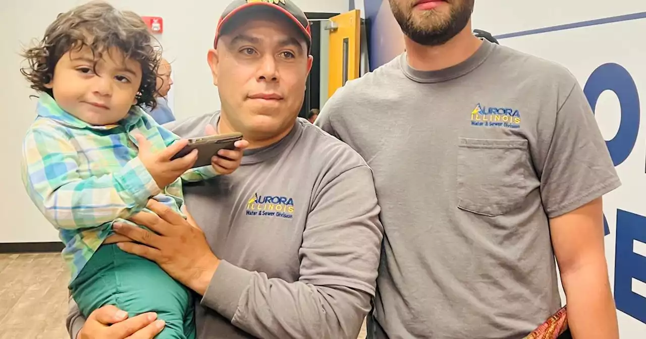 Two Aurora city employees credited with saving boy's life