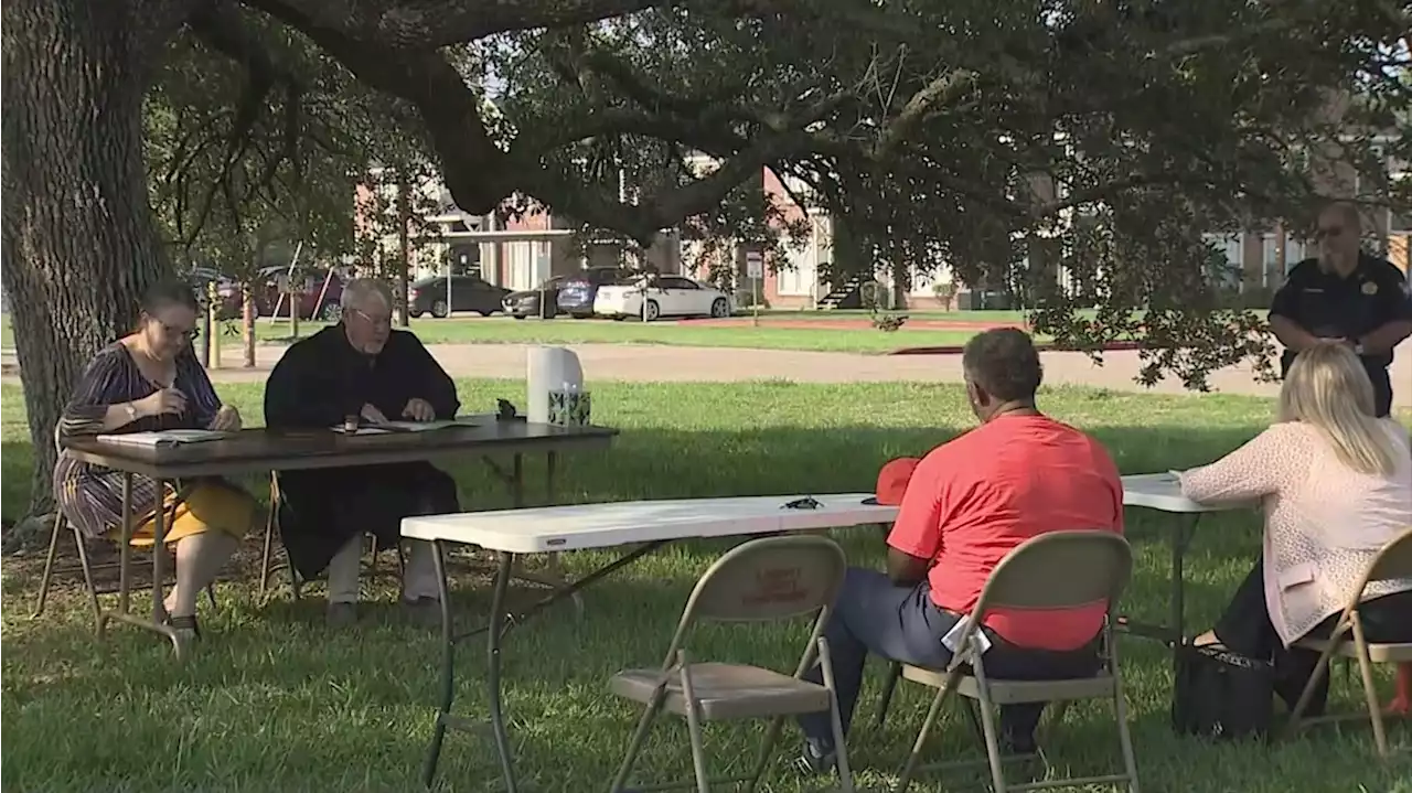 Judge in Liberty County holding court outside under a big tree