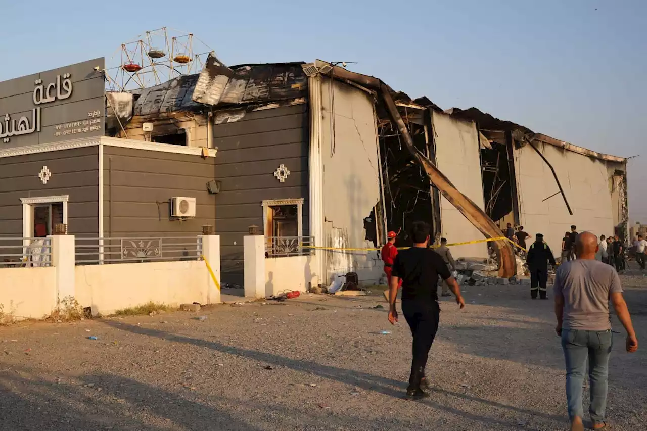 At least 100 killed as fire engulfs Iraq wedding hall