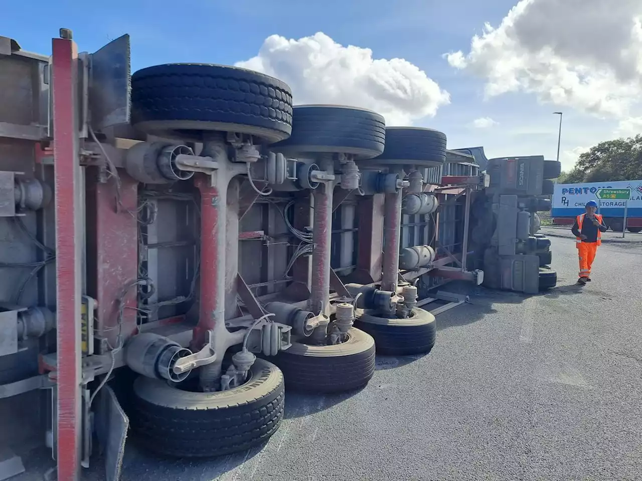 Lorry overturns causing long delays at busy roundabout near Oswestry