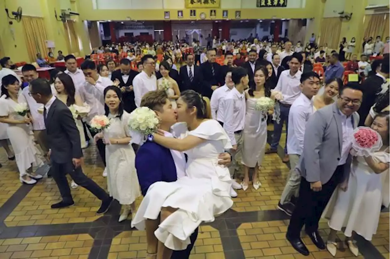 23 couples say 'I do' at mass wedding in Penang