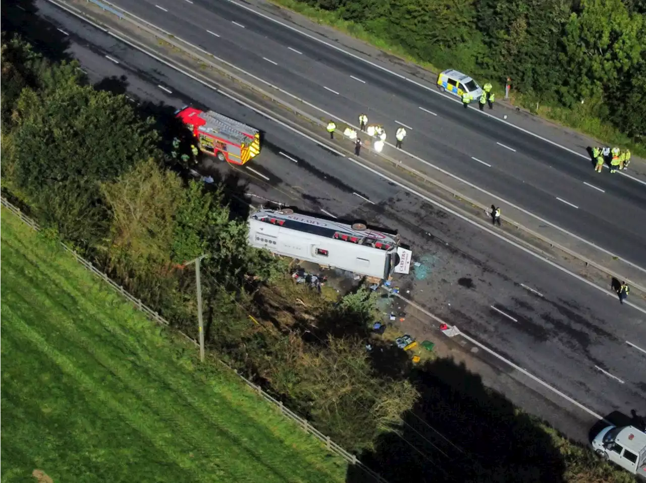 Girl, 14, and coach driver die after school bus overturns on M53 motorway