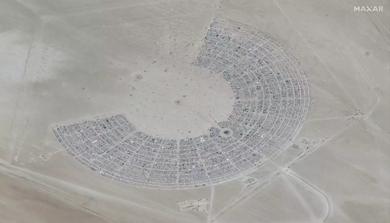 Thousands at Burning Man told to conserve water, food after flooding leaves them confined in desert