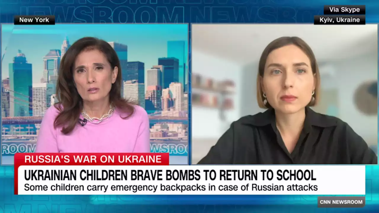 Ukrainian children brave bombs to return to school