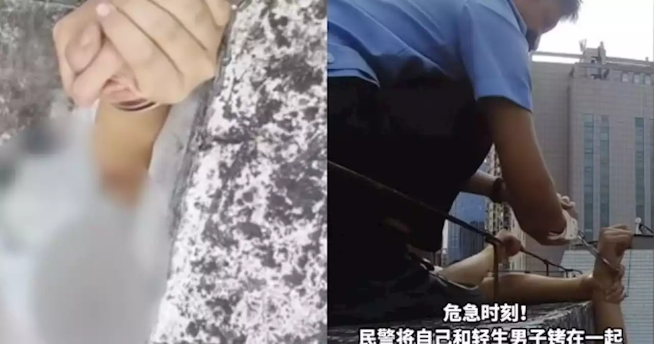 'Hold my hand tightly': Police officer in China handcuffs himself to suicidal man on ledge in viral video