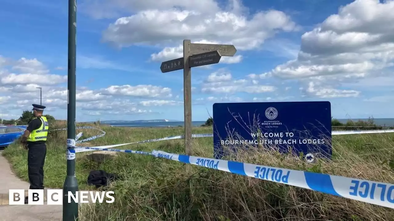 Bournemouth: Man and a woman charged over cliff-side remains find