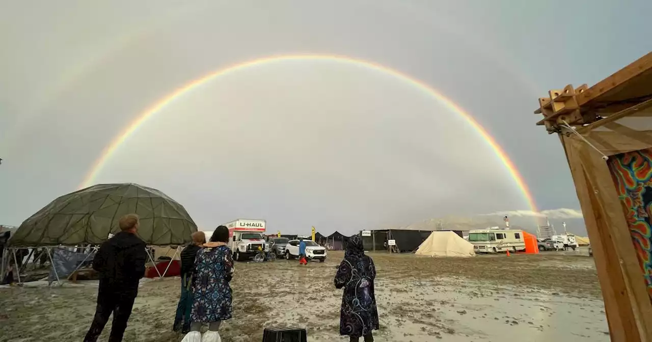 Burning Man attendees cope with muddy treks home following weather-related festival fallout