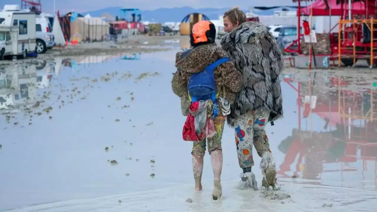 Desert rain leaves thousands stranded in muddy mess at Burning Man