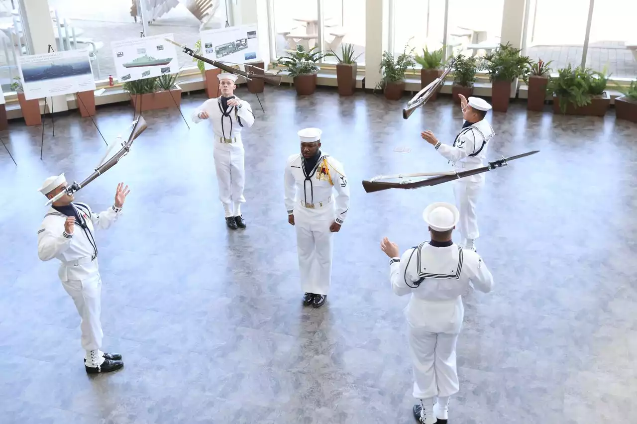 Oohs and aahs, as rifles fly, during U.S. Navy Week performance at Great Lakes Science Center