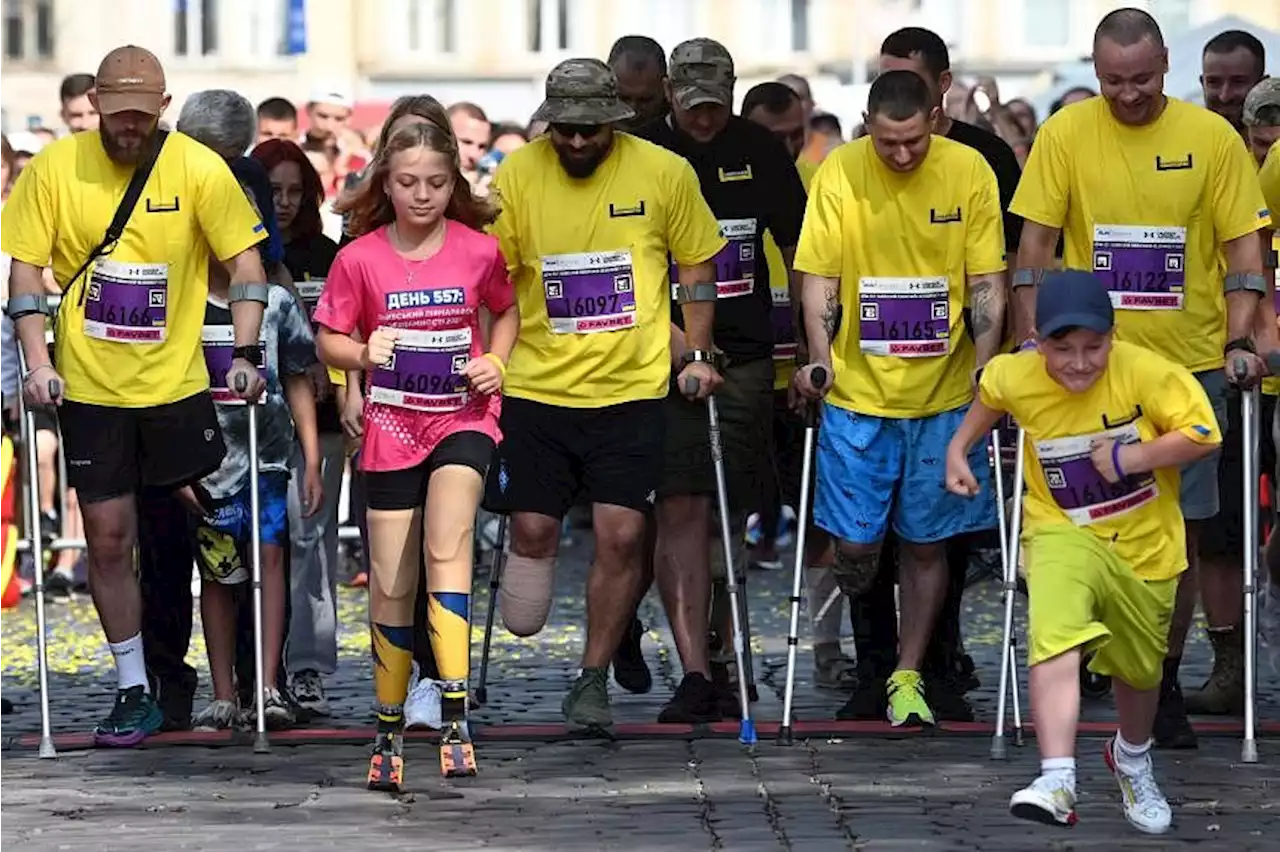 Girl, 12, who lost legs in Russian missile attack, runs at Ukraine city half-marathon