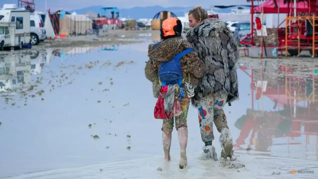 Burning Man revellers unfazed by deluge and deep mud