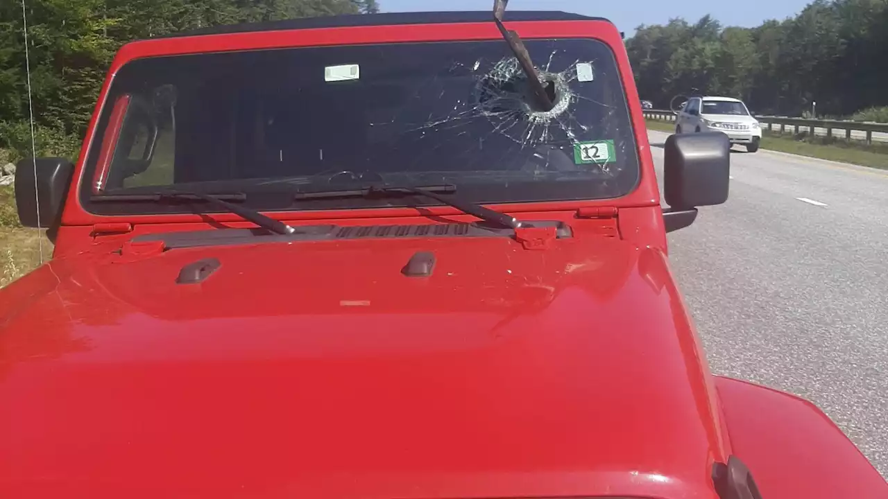 Metal debris strikes car windshield on Maine highway and comes within inches of motorist's face