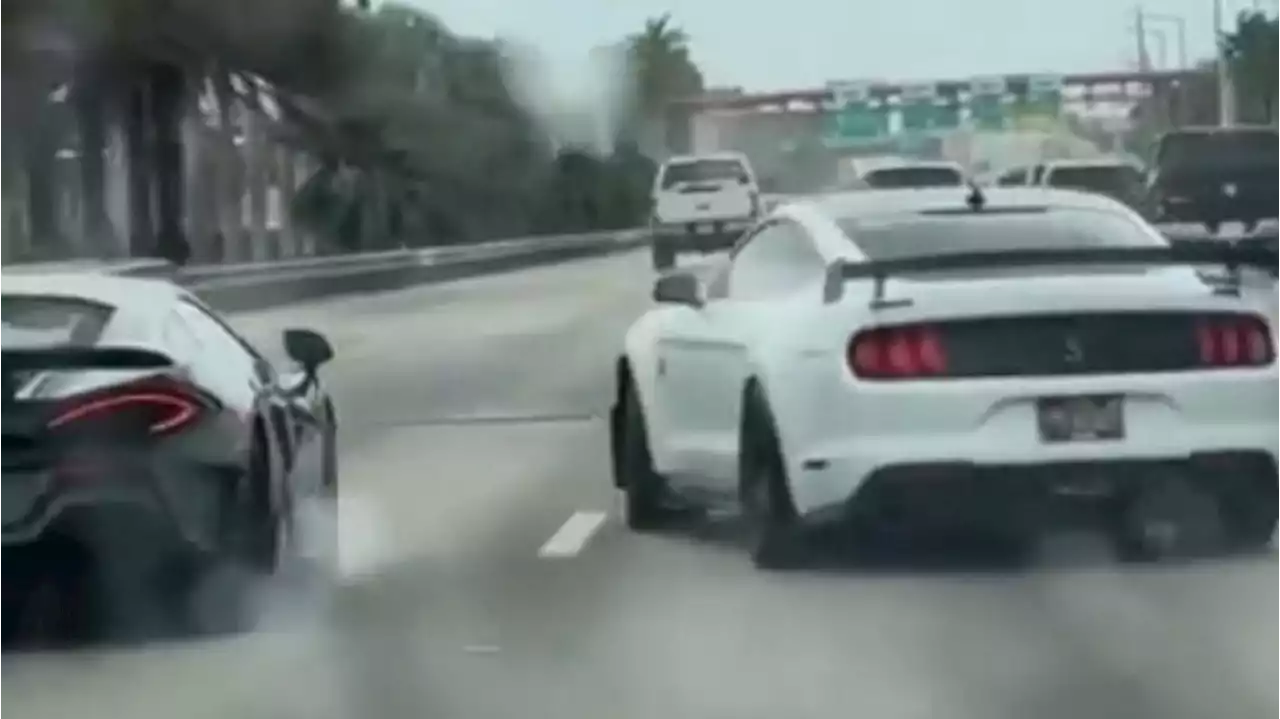 Mustang Driver Fishtailing On Wet Road Manages Not To Hit Nearby McLaren