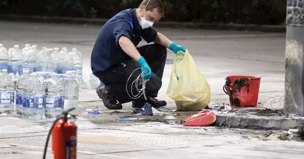 Forensics pictured examining petrol station after man 'sets himself on fire'