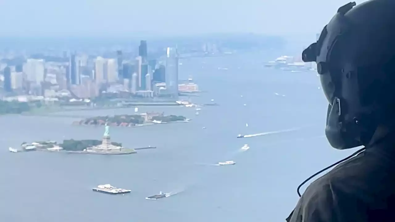 As a helicopter circles the Statue of Liberty, new military journeys begin