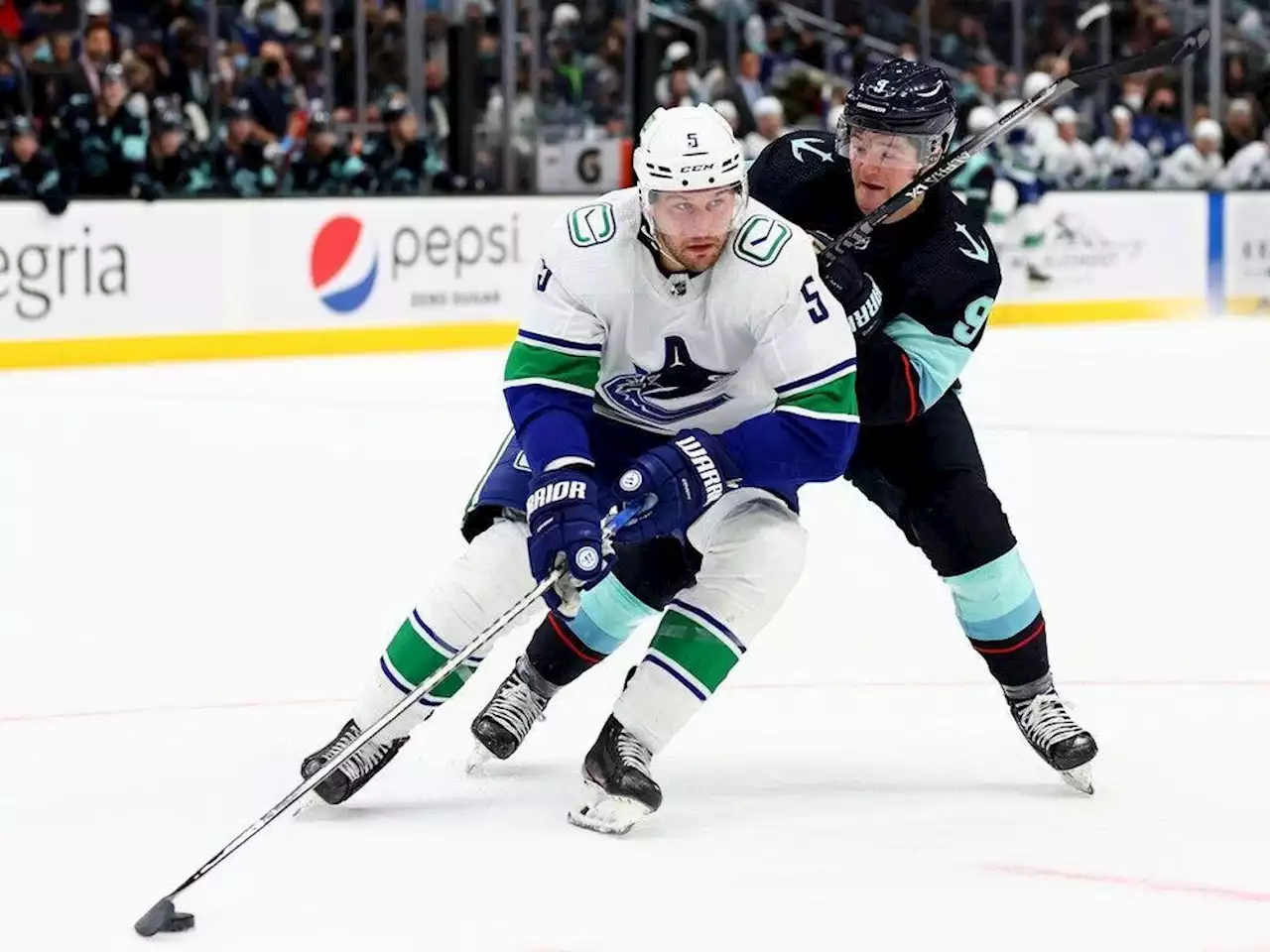 Canucks' Tucker Poolman not expected at training camp: Report