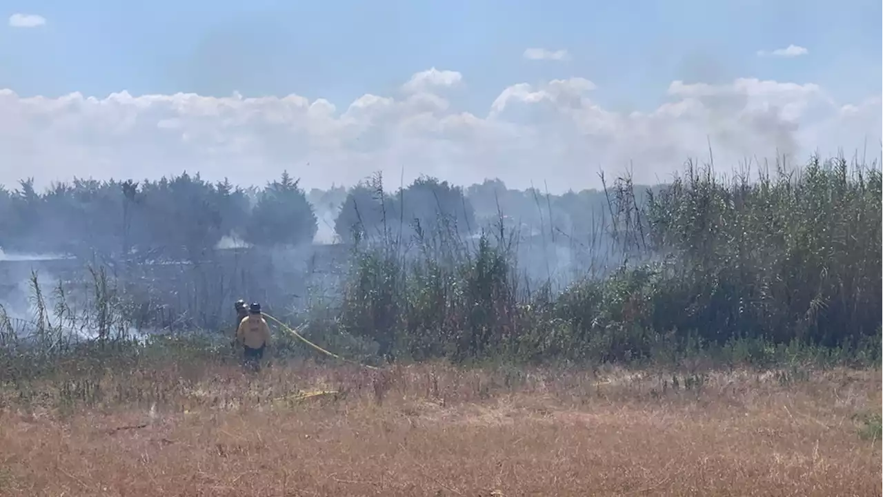 SE Travis County grass fire threatens homes, sparked by construction activities