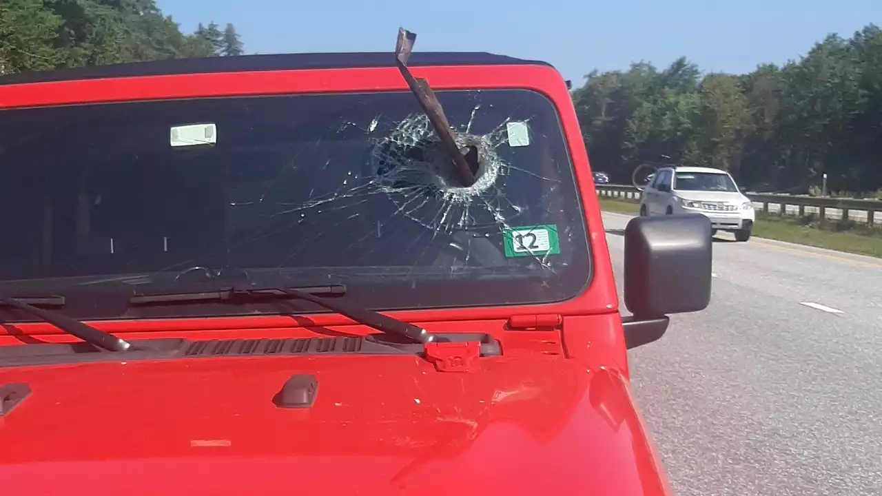 Metal debris breaks through windshield on Maine Turnpike, striking inches from driver's face