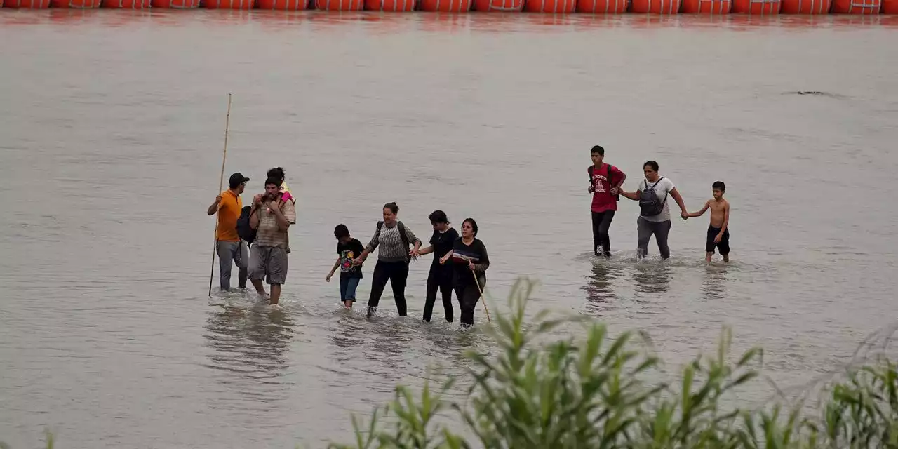 Judge orders Texas to move floating barrier used to deter migrants from middle of Rio Grande