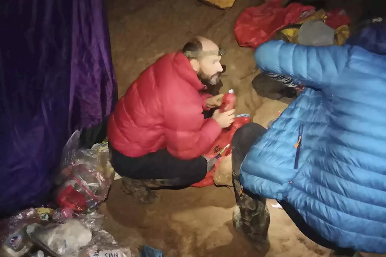 An American explorer trapped deep inside a Turkish cave says his health is improving