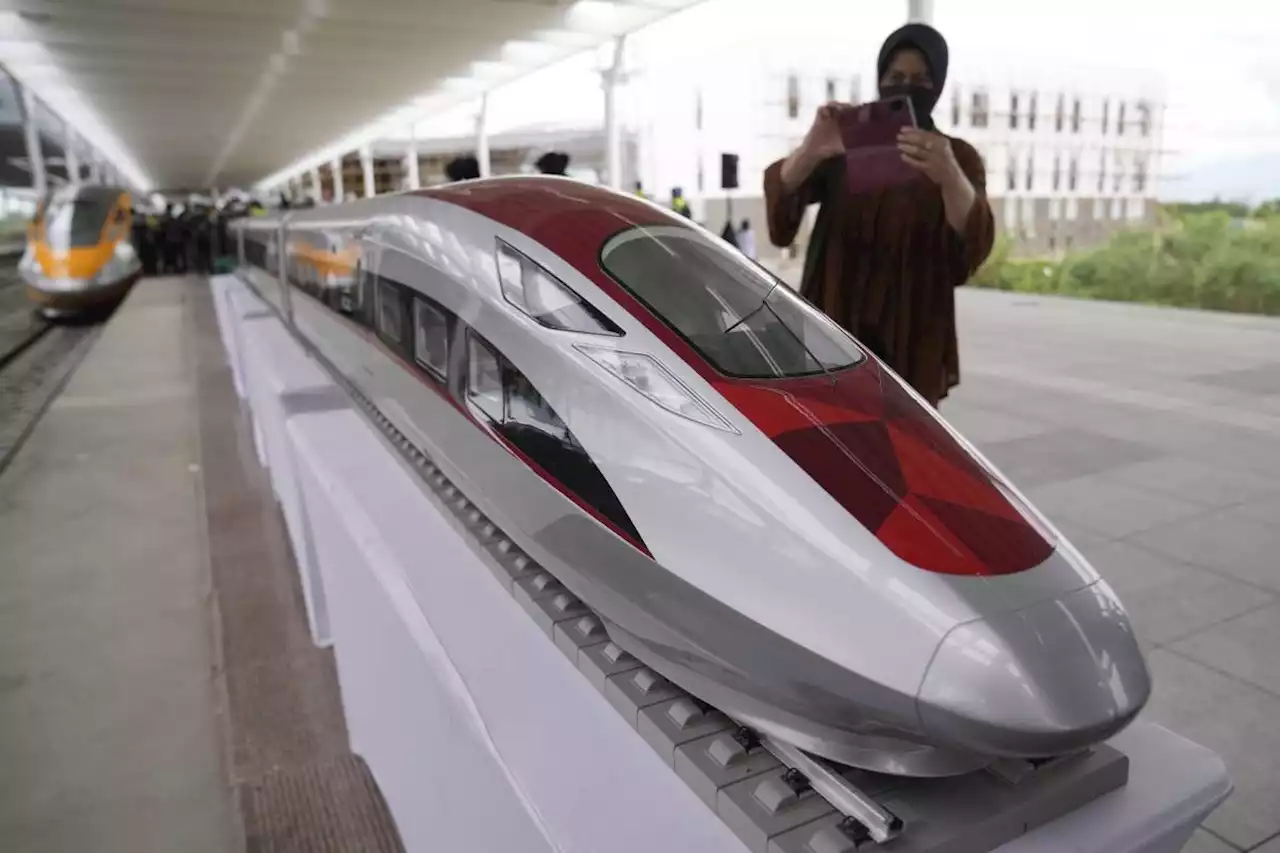 Chinese Premier Li Qianq takes a test ride on Indonesia's new high-speed railway