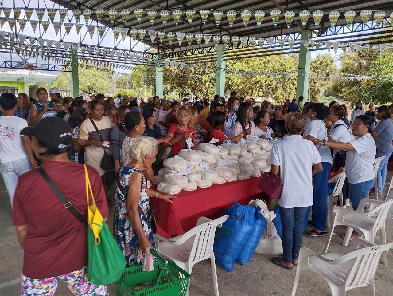 Residents in Palawan town flock to buy affordable rice