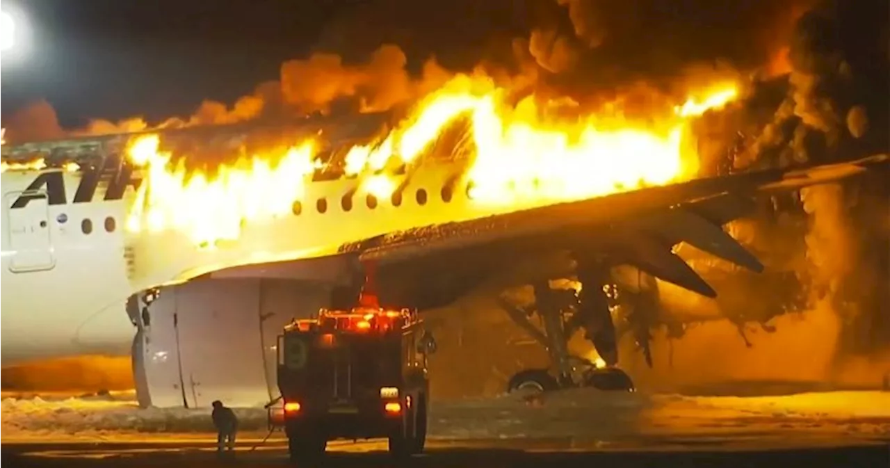 Passenger plane and coast guard aircraft collide at Tokyo's Haneda Airport