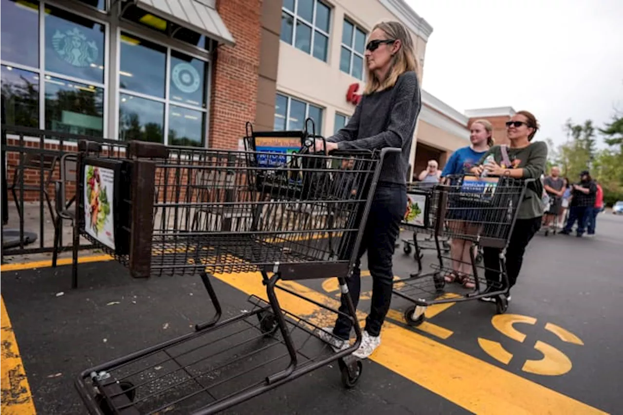 The Latest: Residents line up for food and water in storm-battered North Carolina mountains