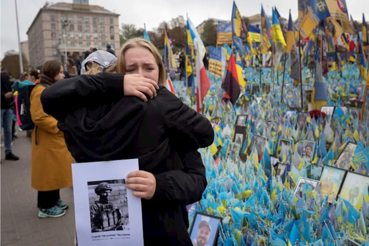 A likely Russian artillery strike kills at least 6 at a Ukrainian market