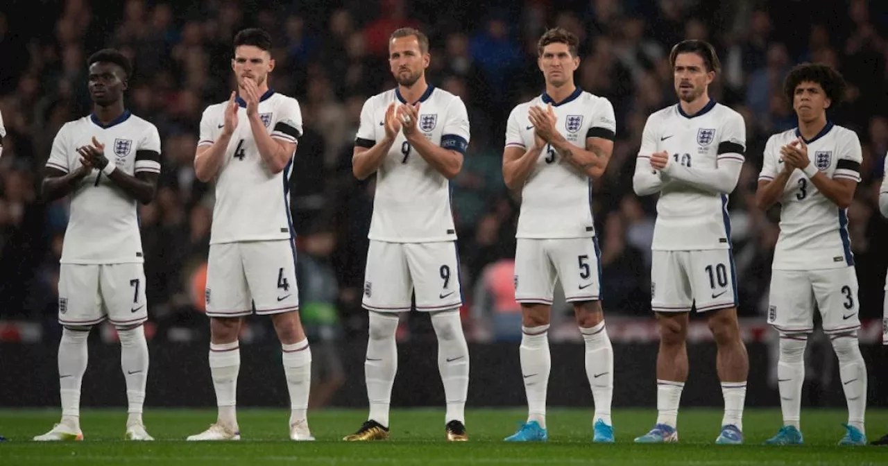 Why are England and Greece wearing black armbands at Wembley tonight?