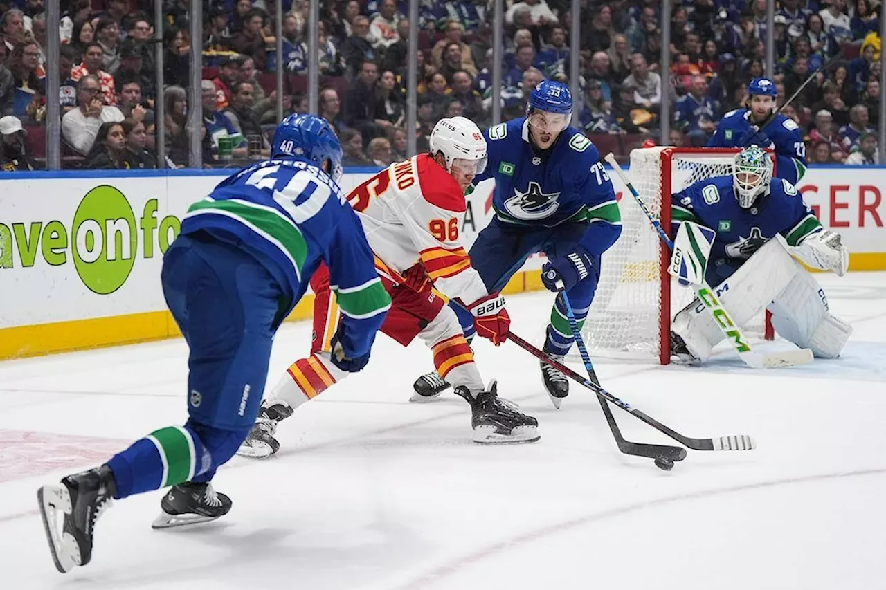 Calgary Flames battle back to defeat Vancouver Canucks 6-5 in OT