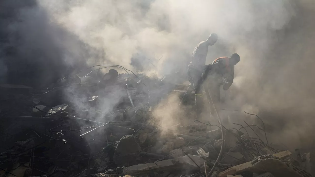 Israel's deadliest strike in central Beirut leaves Lebanese stunned as they dig through the rubble